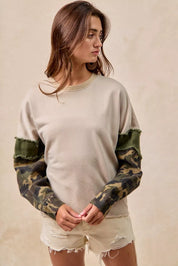 BiBi Camo Sleeve French Terry Top with Frayed Edge | Daverri Fashions