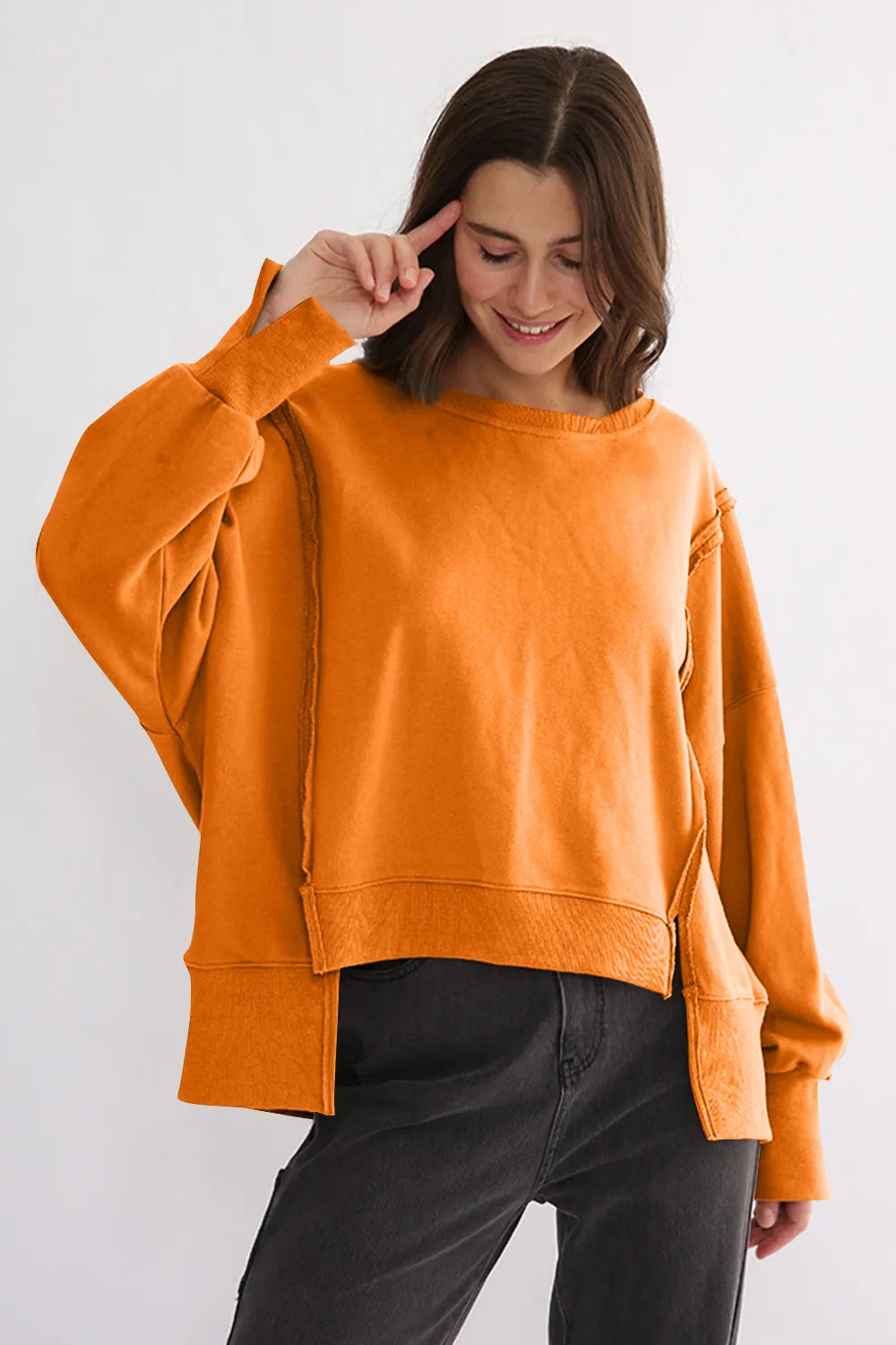 Tangerine One Size Exposed Seam High-Low Long Sleeve Sweatshirt | Daverri Fashions