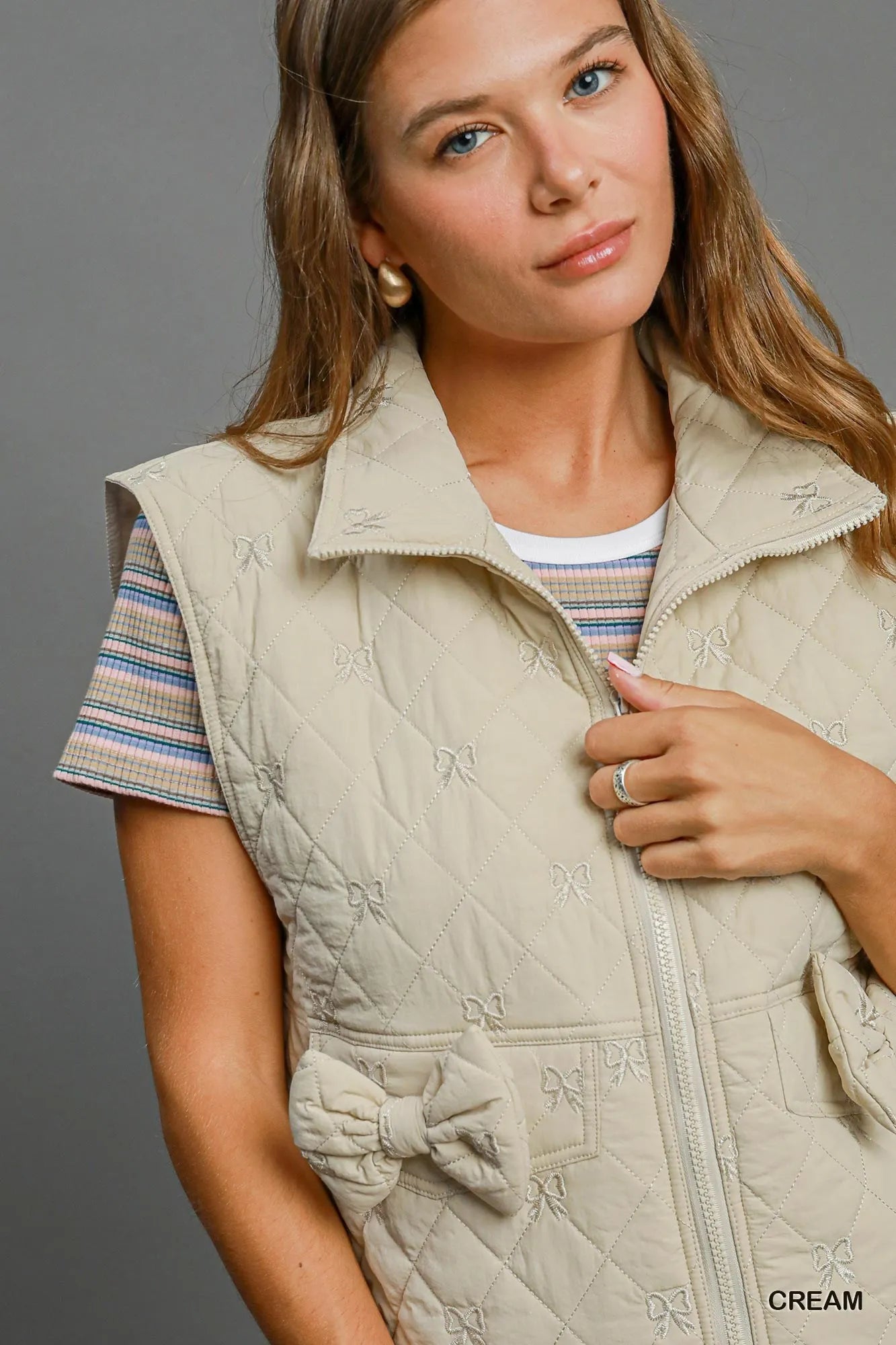 Umgee Sleeveless Quilted Vest with Bow Details | Daverri Fashions