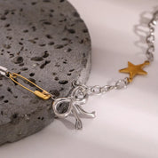 Two-Tone Stainless Steel Bow Star Necklace | Necklaces Daverri Fashions