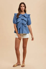 Annie Wear Stripe Front Bow Denim Peplum Blouse | Daverri Fashions