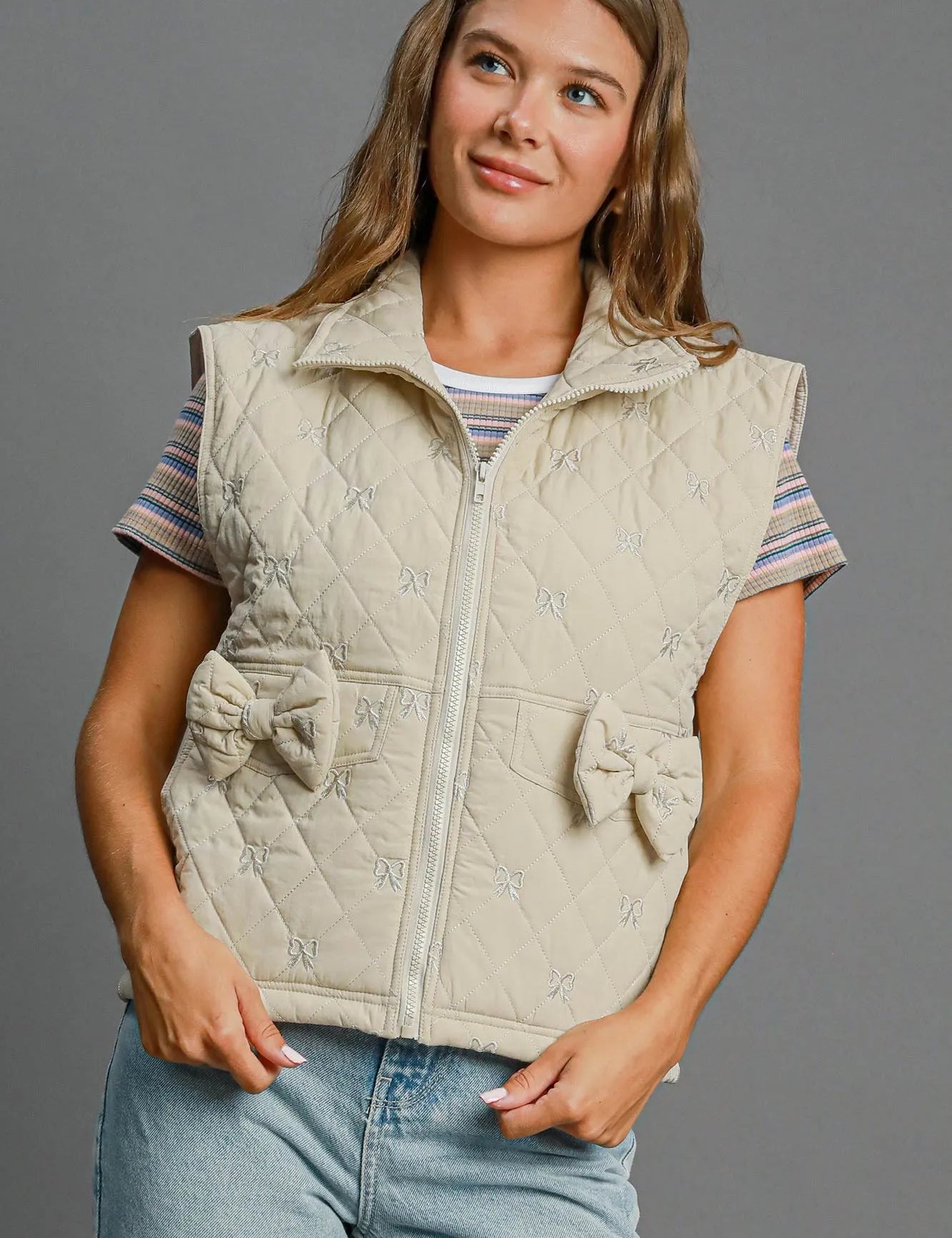 CREAM Umgee Sleeveless Quilted Vest with Bow Details | Daverri Fashions