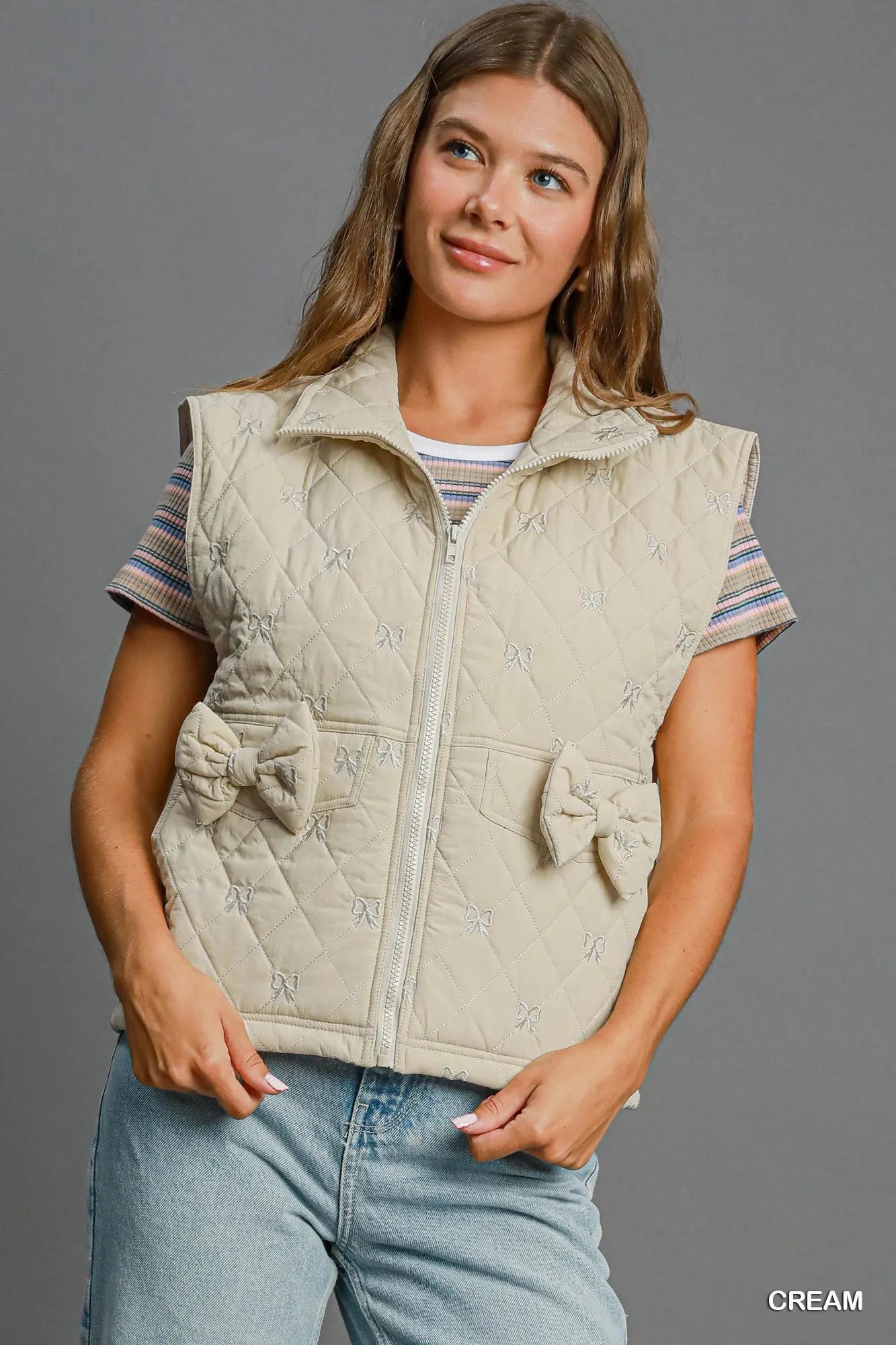 CREAM Umgee Sleeveless Quilted Vest with Bow Details | Daverri Fashions