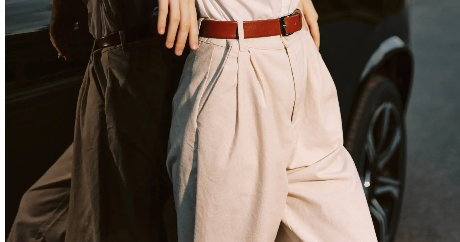 Beige pleated wide-leg trousers with red leather belt in BOTTOMS collection
