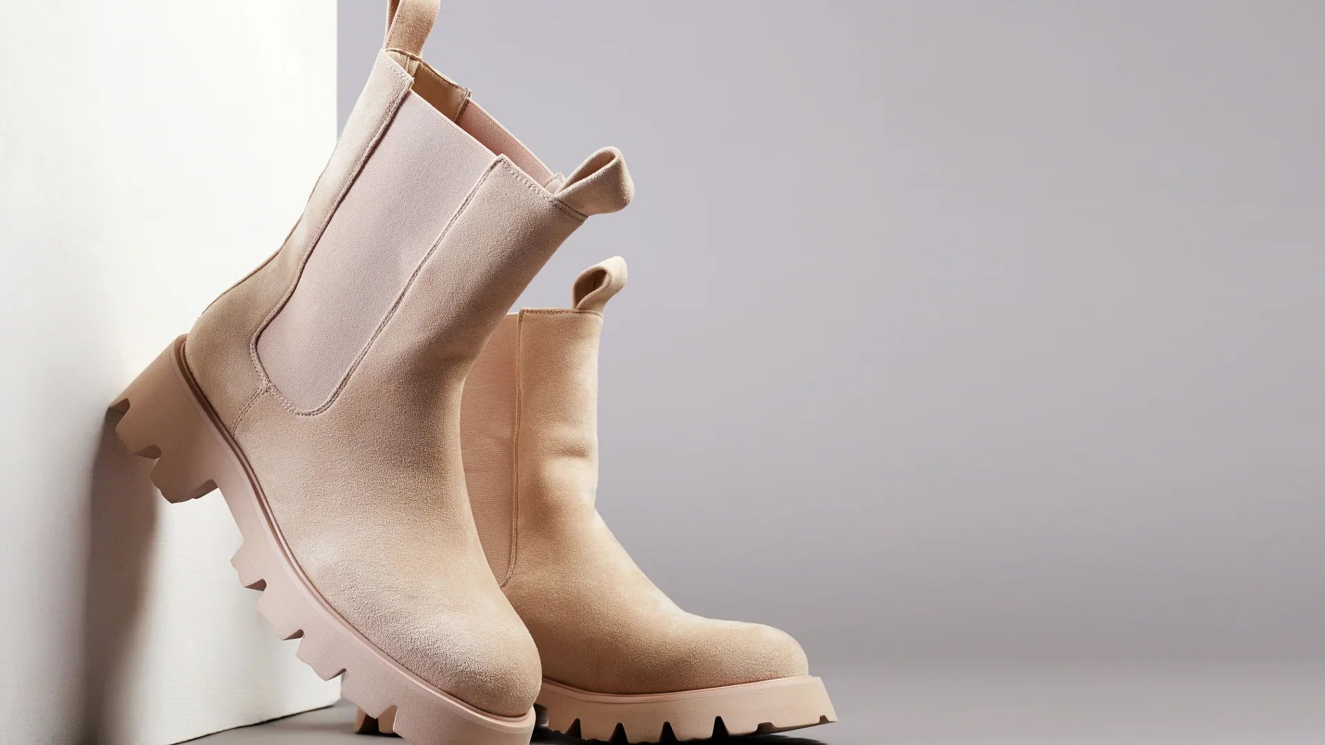 Beige platform Chelsea boots with studded details, women’s collection