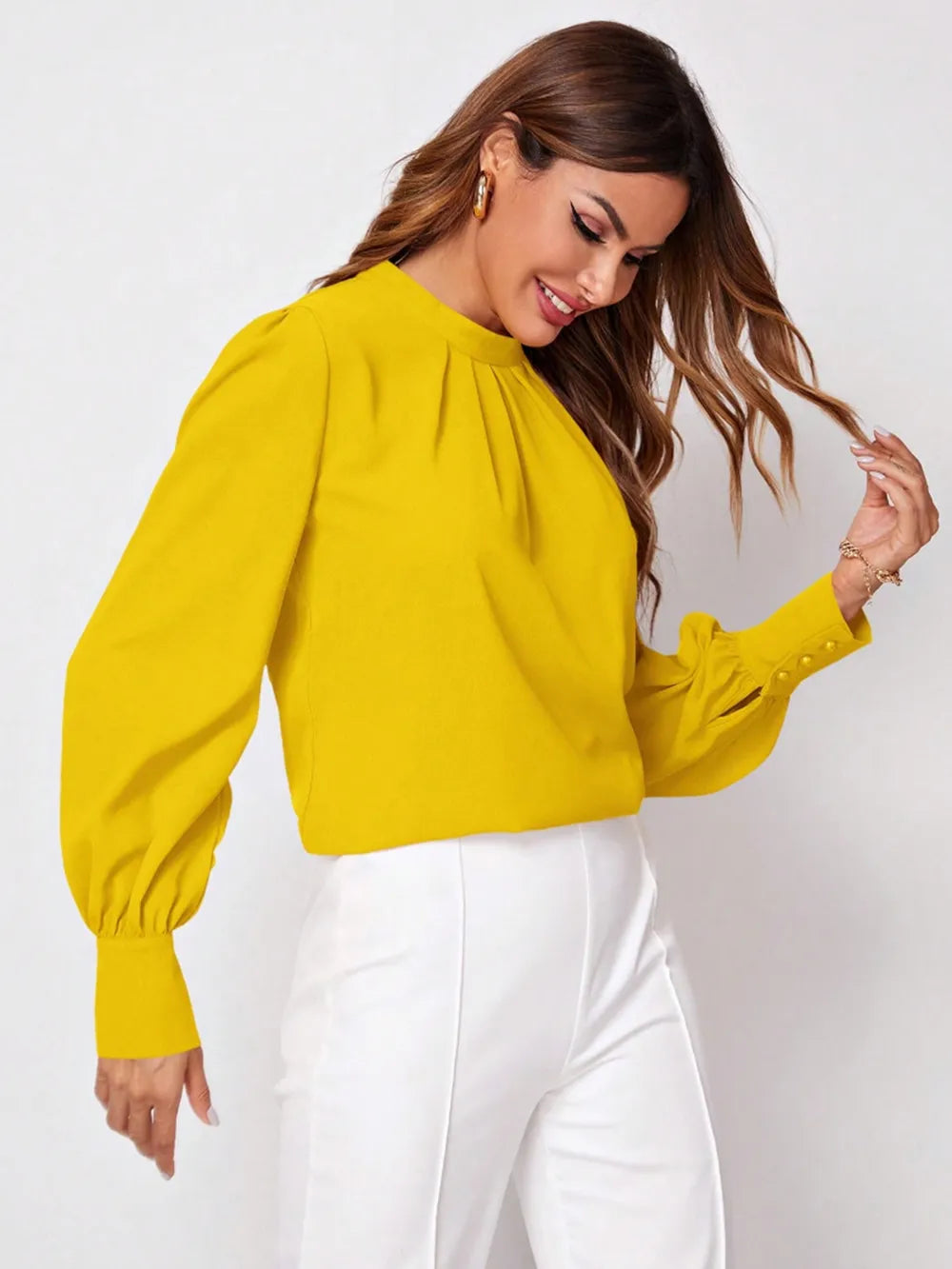 Bright yellow ruched mock neck long sleeve blouse with puffed sleeves