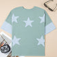 Mint green star-patterned oversize t-shirt with frayed denim patches and light blue cuffs