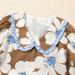 Brown floral print blouse with white blue pattern, ruffled collar, striped tie sleeves