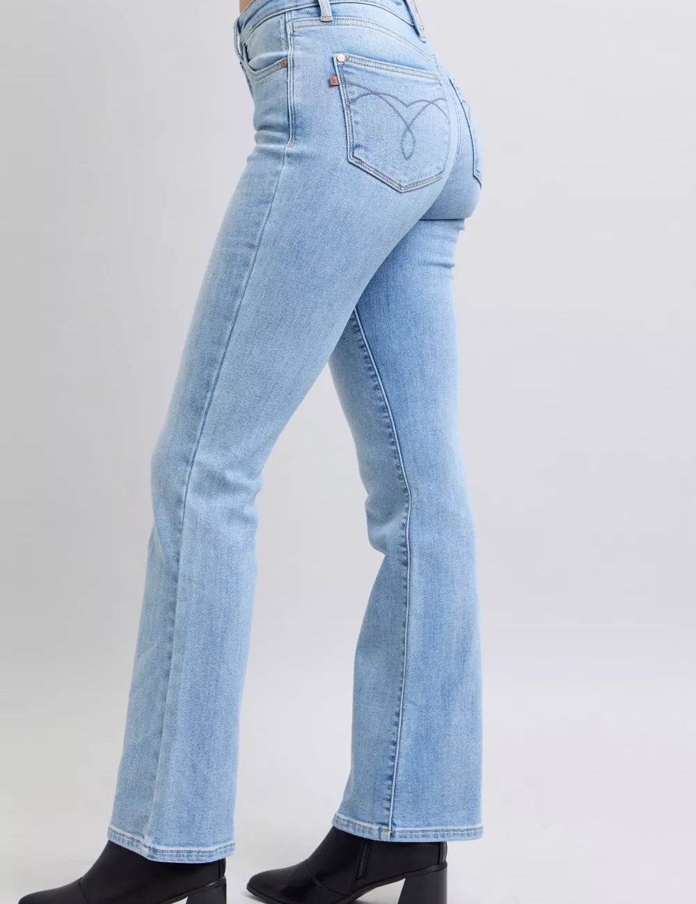 Judy Blue mid-rise thermal bootcut jeans in light blue with black ankle boots