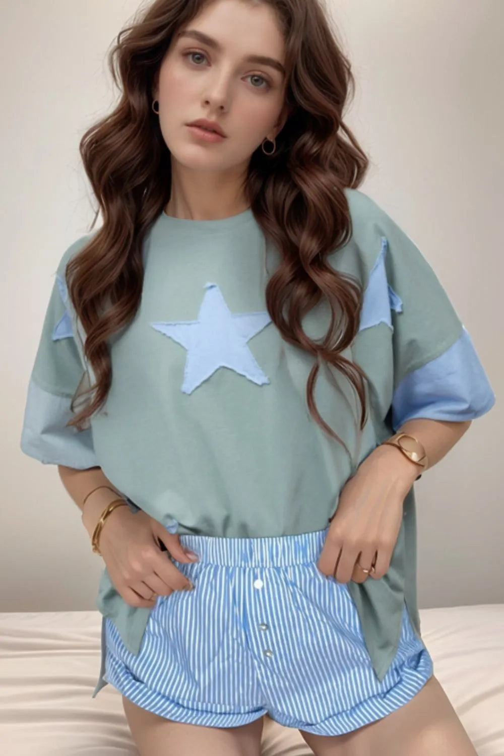Light blue oversized t-shirt with frayed denim star patches