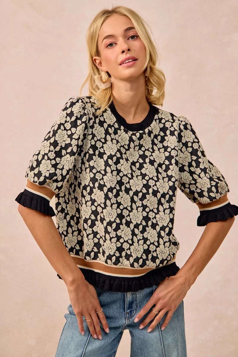 Black and cream floral BiBi rose knit top with ruffled puff sleeves