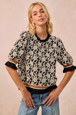 Black and cream floral BiBi rose knit top with ruffled puff sleeves