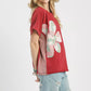 Red Umgee mineral wash French terry top with pink green white patchwork flowers