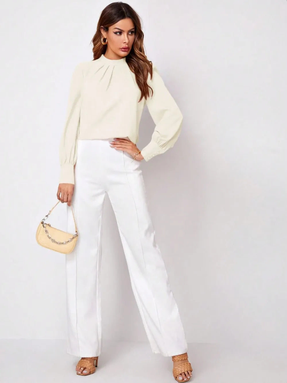 Cream-colored structured shoulder bag with chain strap in Ruched Mock Neck Blouse