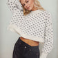 Daverri white cropped heart-patterned round neck sweater with black butterfly prints and large bow sleeve