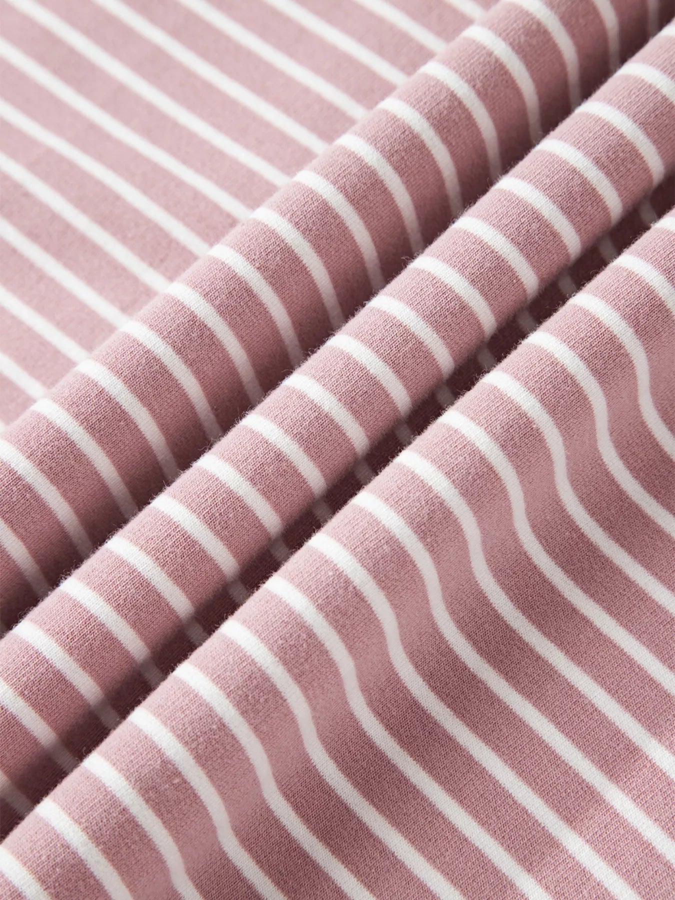 Dusty pink and white striped hoodie fabric with textured weave