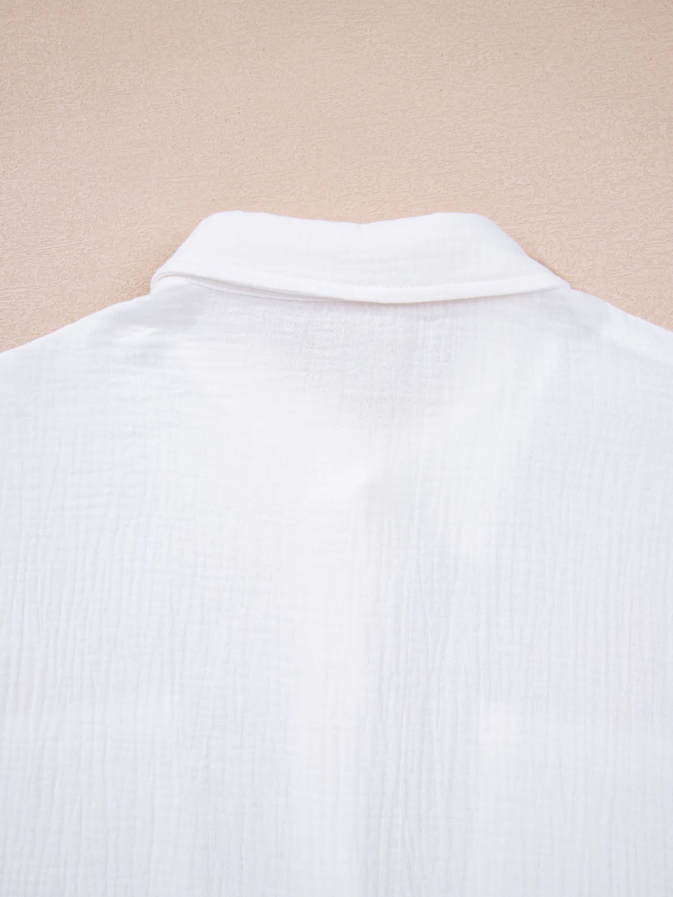 White cotton polo shirt with crisp collar, lace sleeves, and ribbing