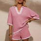 Pink and white striped knit two-piece set with collared V-neck top