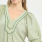 Umgee Stripe V-Neck Blouse in sage green and white vertical stripes with ruffles