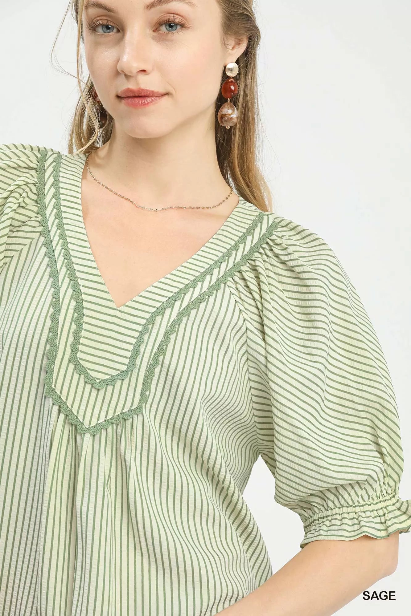 Umgee Stripe V-Neck Blouse in sage green and white vertical stripes with ruffles