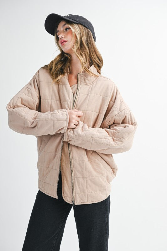 Beige quilted Dixie Jacket with soft padded texture and clean stitching