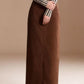 Raw hem maxi denim skirt with straight-cut full-length brown fabric and front seam