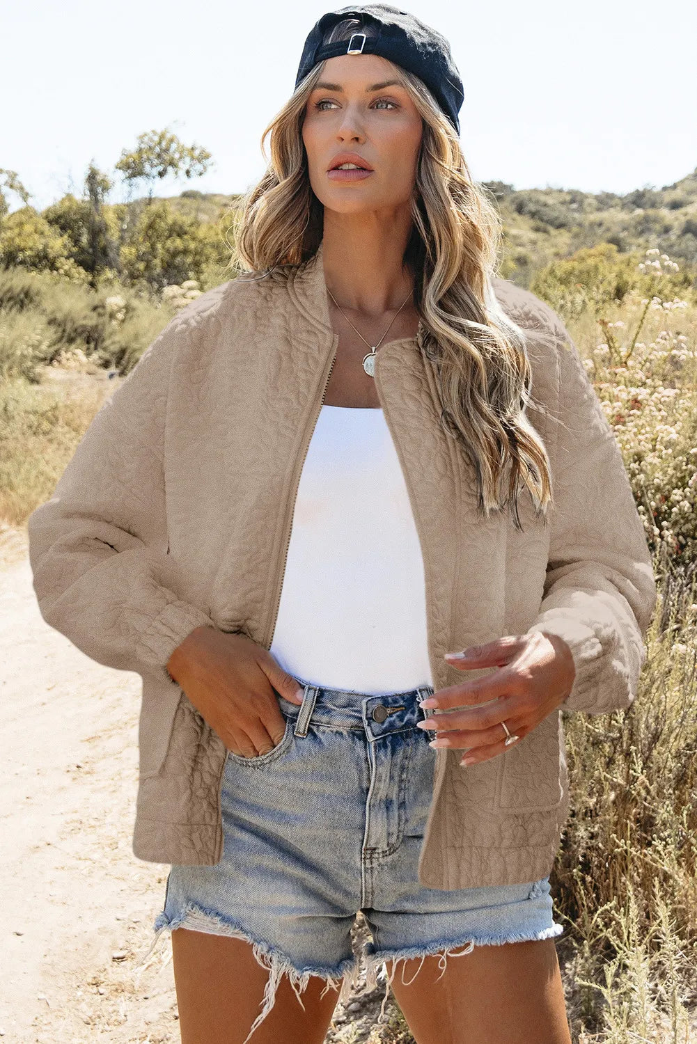 Women’s beige quilted bomber jacket with baseball collar and zipper