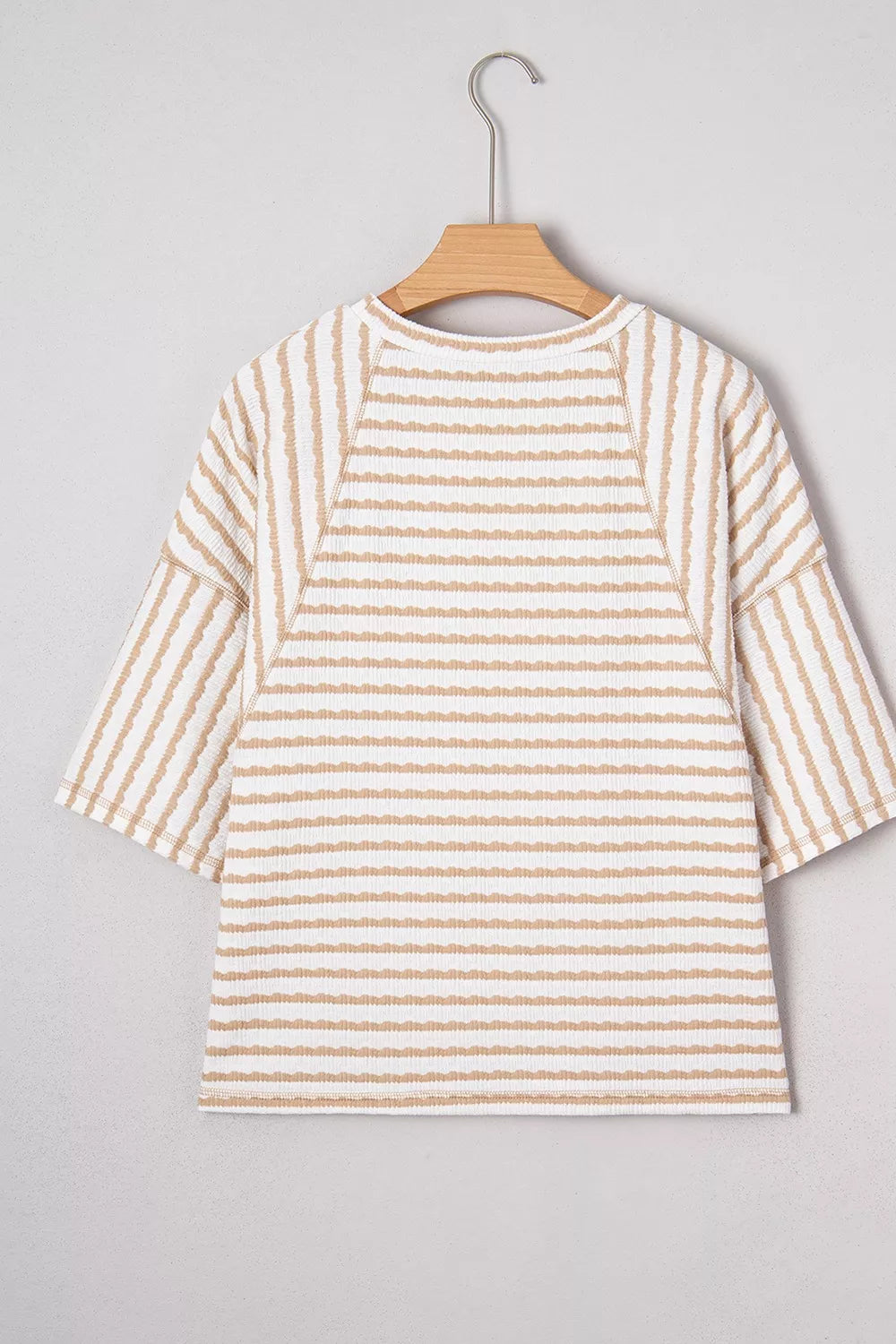 Daverri Fashions beige striped textured knit split hem top on hanger