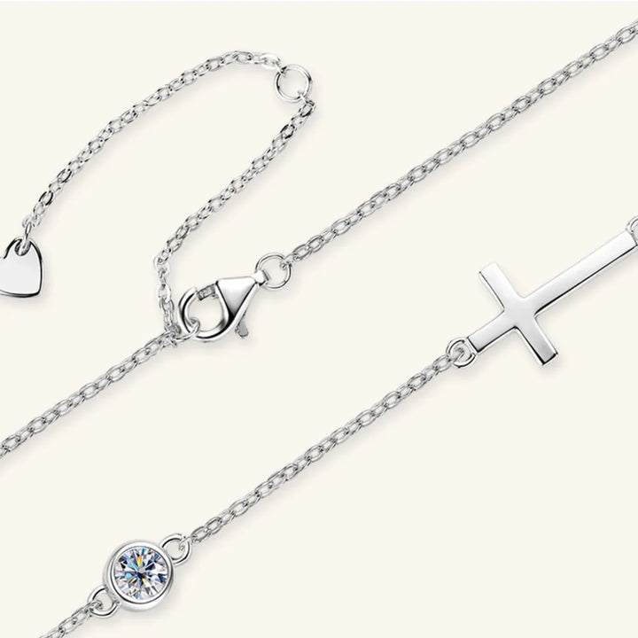 Silver necklace with heart, moissanite round stone and silver cross