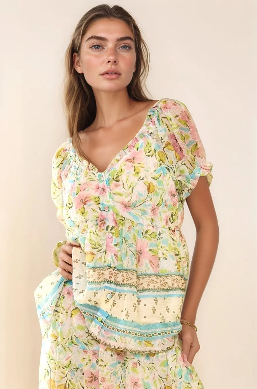 Woman in Davi & Dani Spring Floral Border Print Ruffled Textured Top