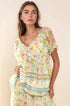 Woman in Davi & Dani Spring Floral Border Print Ruffled Textured Top