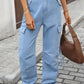 High-waisted light-wash denim cargo pants with pockets and straight-leg fit