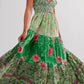 Floral tiered maxi dress in vibrant green with pink purple blossoms
