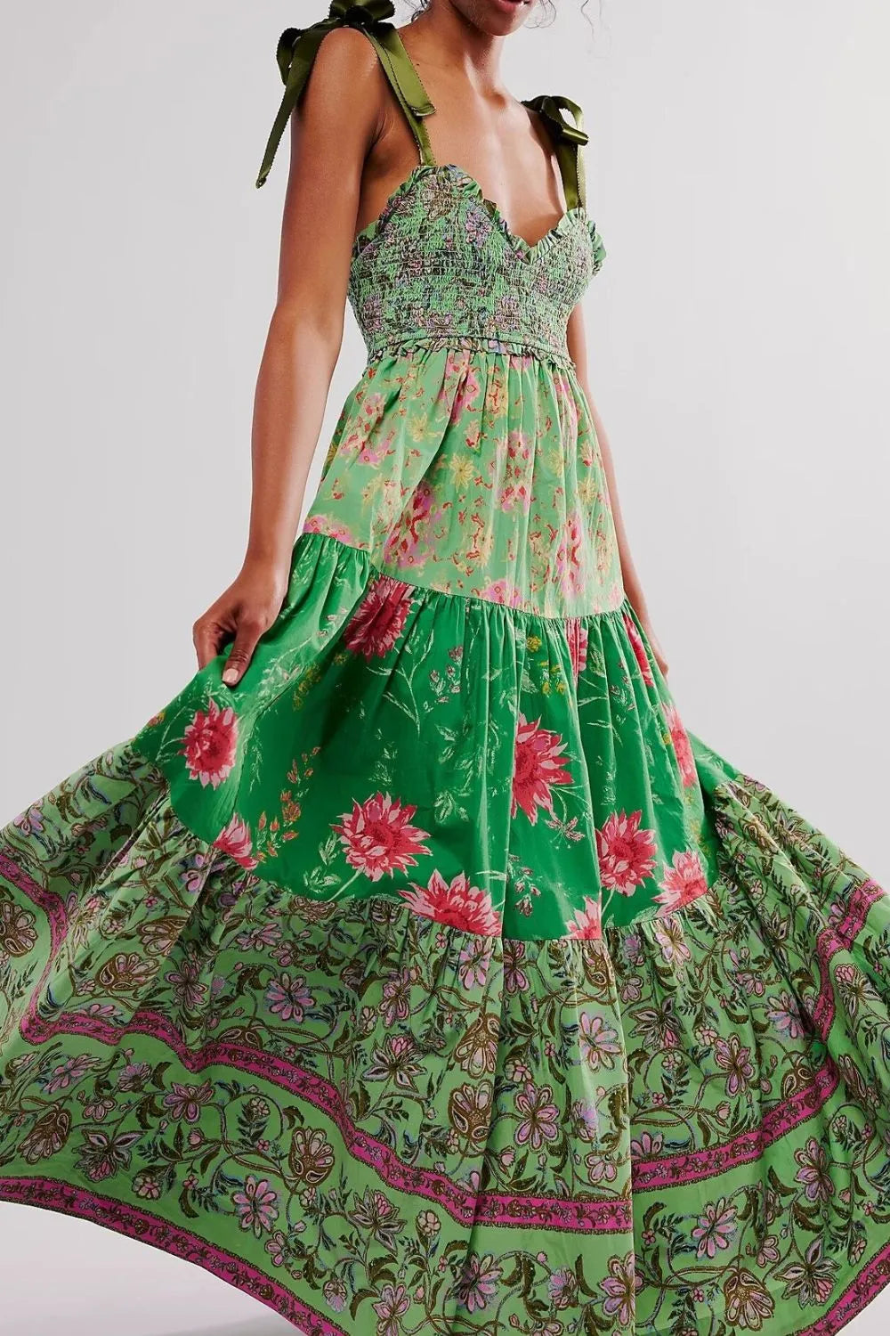 Floral tiered maxi dress in vibrant green with pink purple blossoms