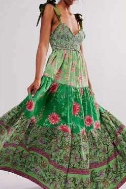 Floral tiered maxi dress in vibrant green with pink purple blossoms