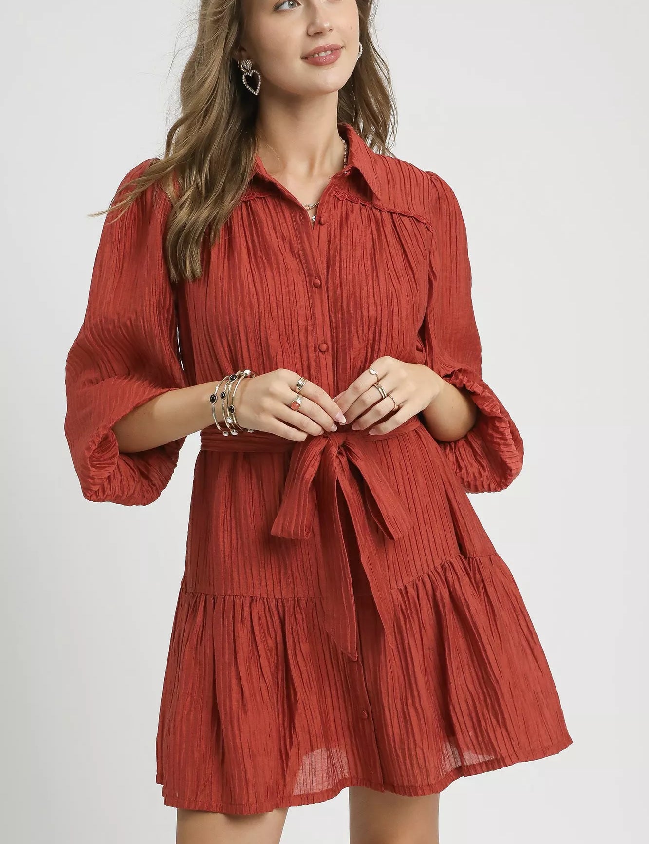 Rust-colored Umgee crinkle button-front ruffled mini dress with puff sleeves and tie waist