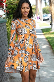 Rust Animal Geo Print Swing Dress with Pockets | Daverri Fashions