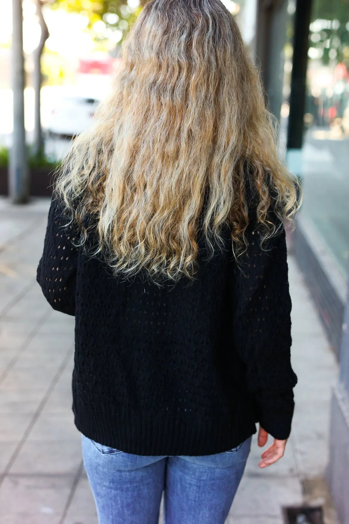 Black cable knit cardigan with embellished sleeves and pockets