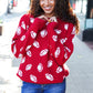 Red knit sweater with white football patterns, Haptics Game Day jacquard