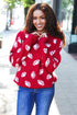 Red knit sweater with white football patterns, Haptics Game Day jacquard