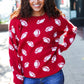 Red knit sweater with white football patterns, Haptics Game Day jacquard