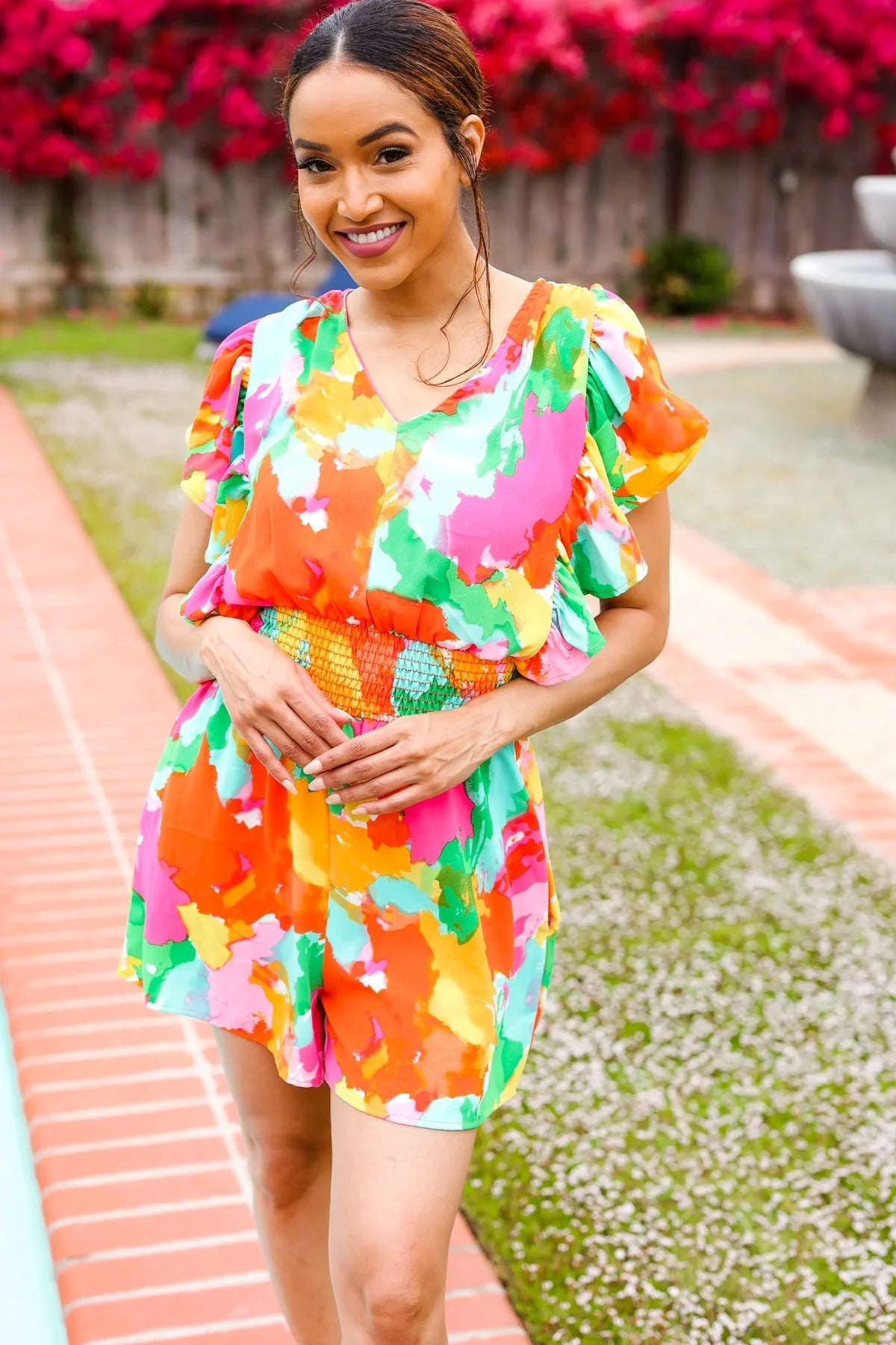 Multicolored abstract floral smocked waist V-neck flutter sleeve romper