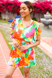 Vibrant tie-dye abstract floral smocked waist V-neck romper with ruffled flutter sleeves