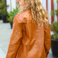 Tan Open Your Heart Rust vegan leather snap button shacket with relaxed fit and subtle stitching