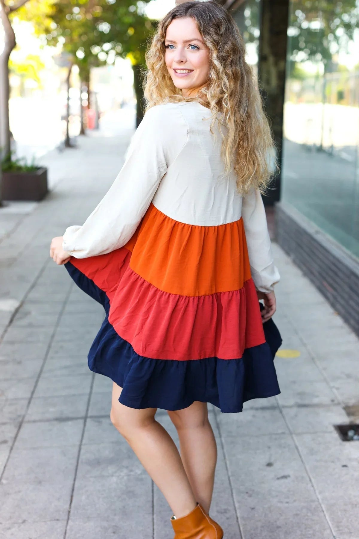 Multicolored tiered babydoll dress with orange, red, navy layers