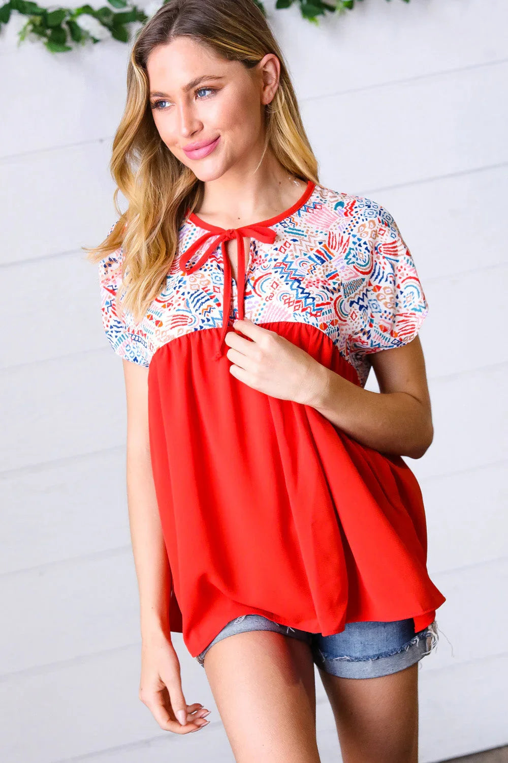 Red boho print tie neck dolman top with ruffled sleeves