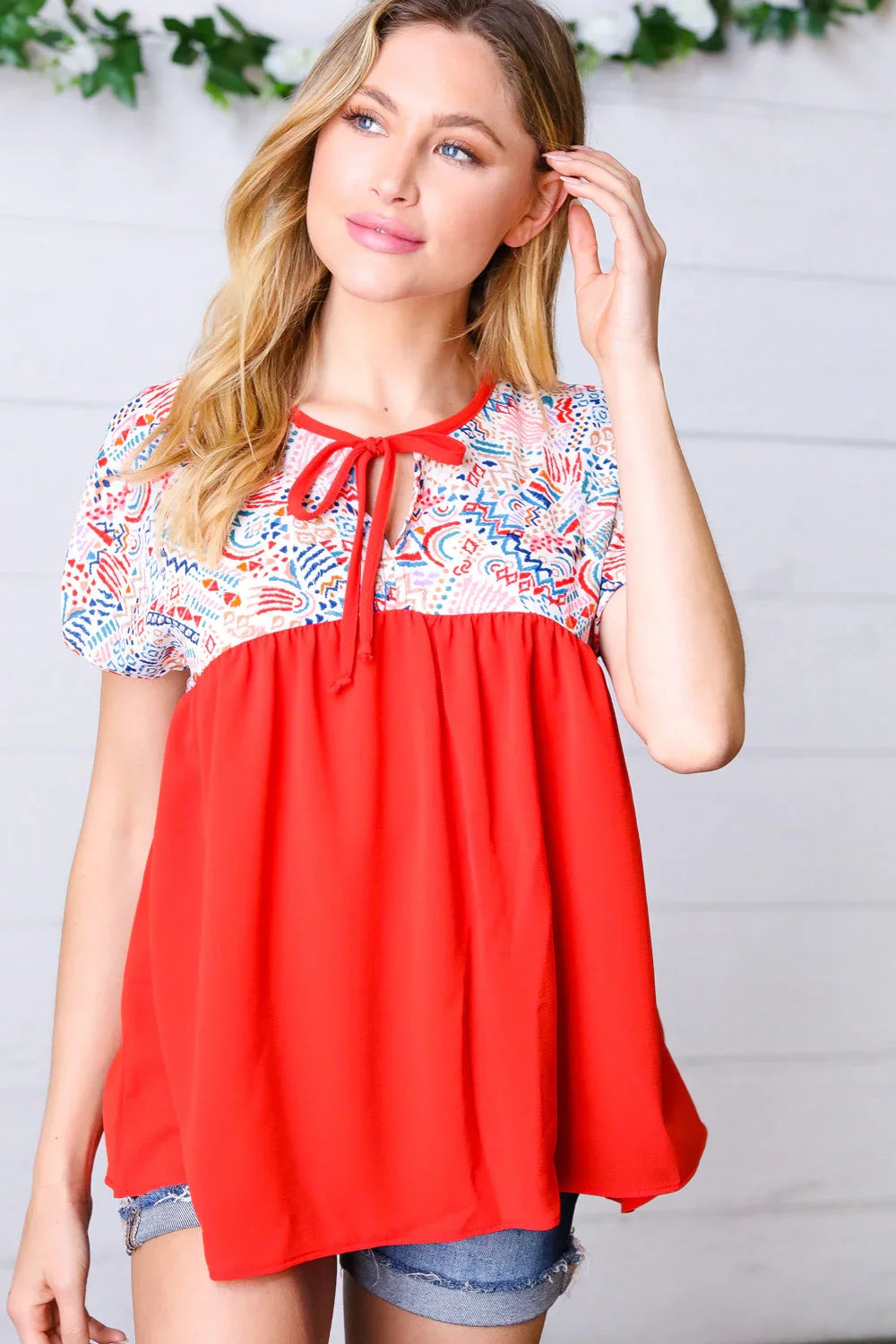 Red boho print tie neck dolman top with floral details