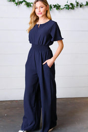 Dark Blue Smocked Waist Notch Neck Crepe Jumpsuit | Daverri Fashions