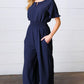 Dark Blue Smocked Waist Notch Neck Crepe Jumpsuit - DAVERRI FASHIONS