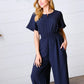 Dark Blue Smocked Waist Notch Neck Crepe Jumpsuit - DAVERRI FASHIONS